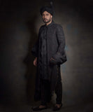 Midnight black sherwani with tonal embroidery and turban.