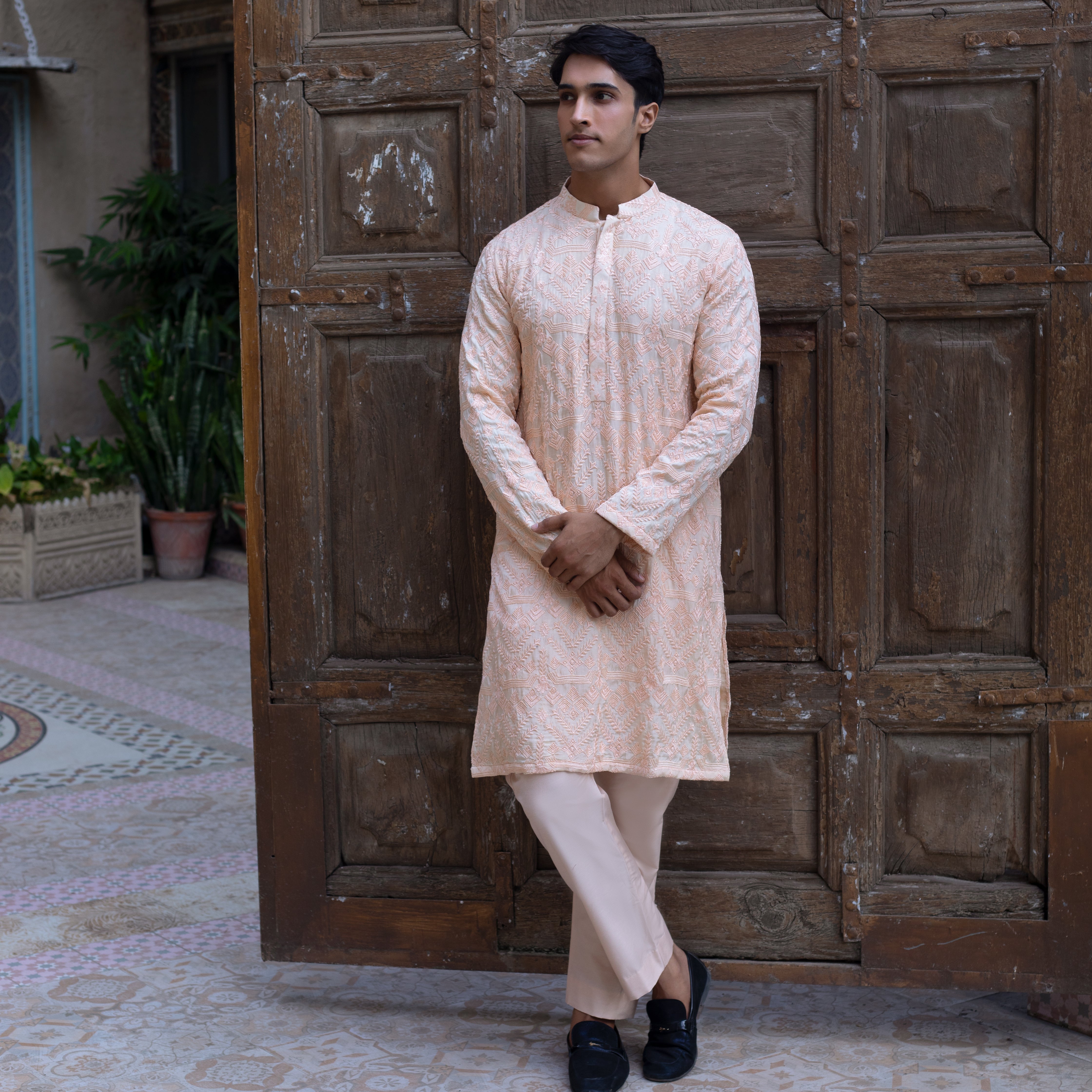 Arsalan Iqbal Faris 3.0 Peach Light Pink Heavily Embroidered Kurta Pajama Full Length Crossed Legs Pose for Men