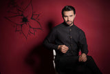 Arsalan Iqbal Jet Black Diamond Textured Embroidered Waistcoat Set Upper Body Seated View for Men