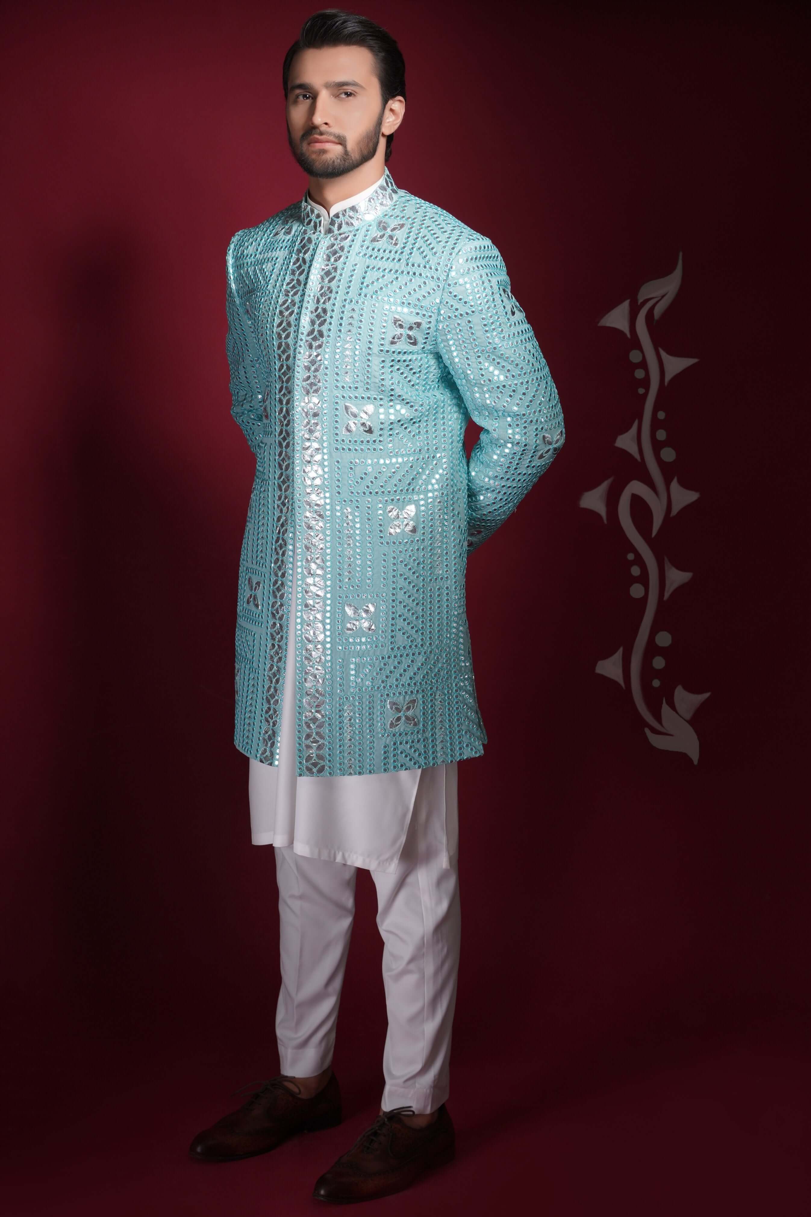 Arsalan Iqbal ice-blue prince coat with silver geometric mirror-work, featuring a mandarin collar and worn over a white long kurta and trousers.