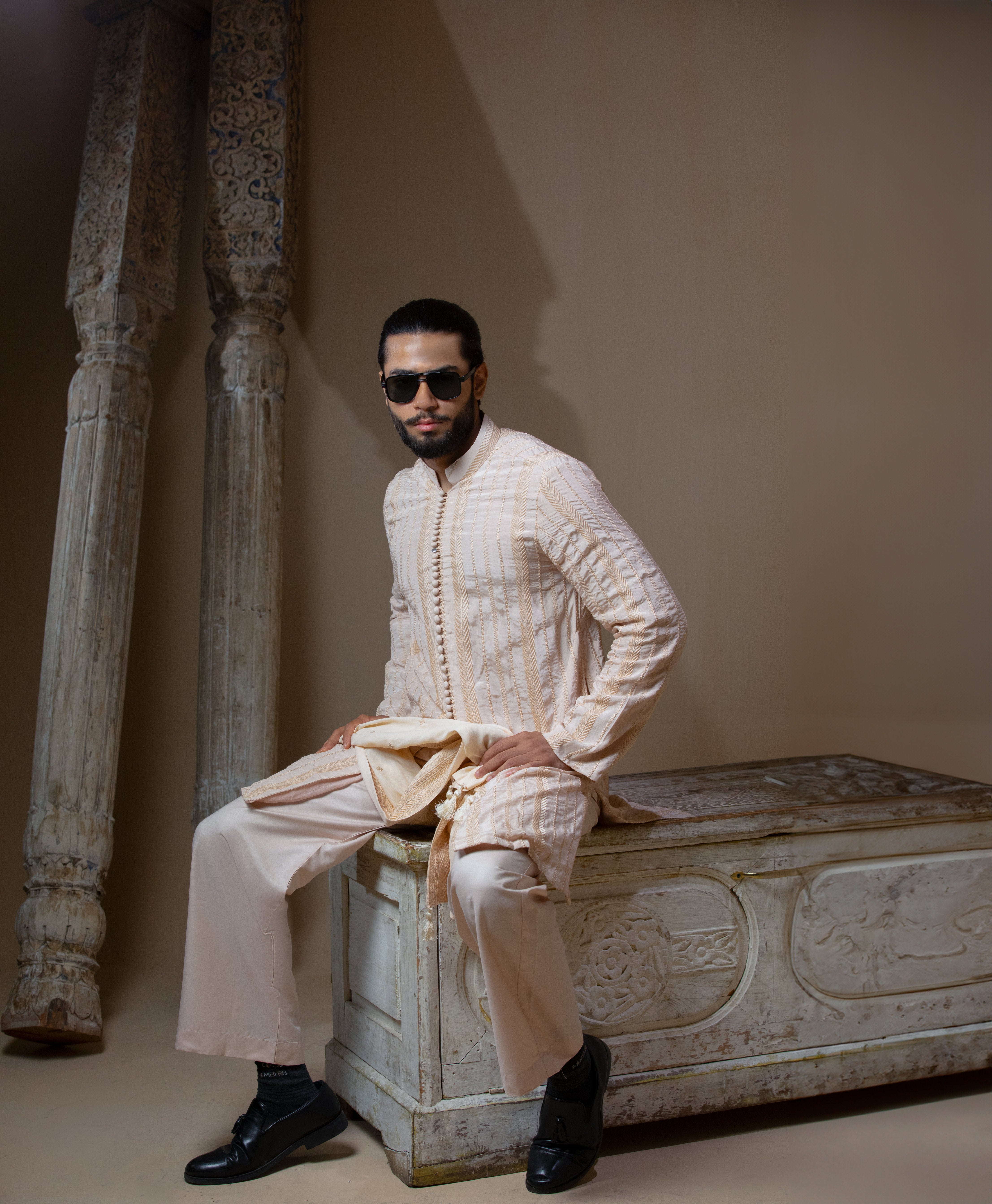 Arsalan Iqbal Sooch'2026 Chevron Embroidered Front Open Kurta with Wide-Leg Pants and Patka Full Length Seated Side View for Men