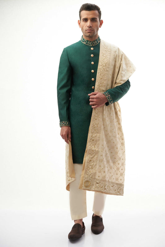 Emerald Green Brocade Silk Sherwani with Handcrafted Zardozi – Elegant and luxurious with intricate zardozi embroidery.