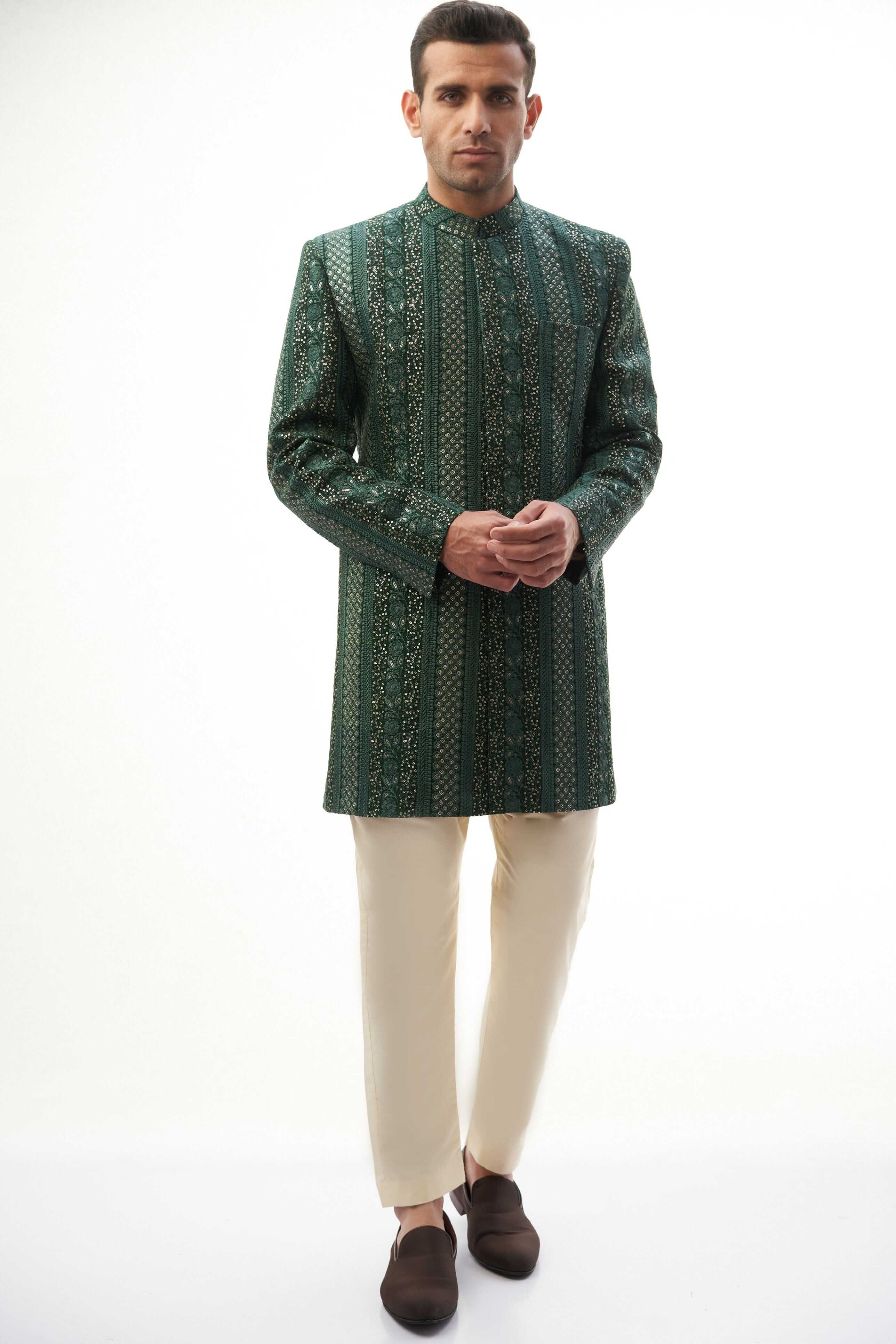 Emerald Green & Gold Short-Length Sherwani with Sequins – Elegant short-length sherwani featuring emerald green and gold colors with intricate sequin detailing.
