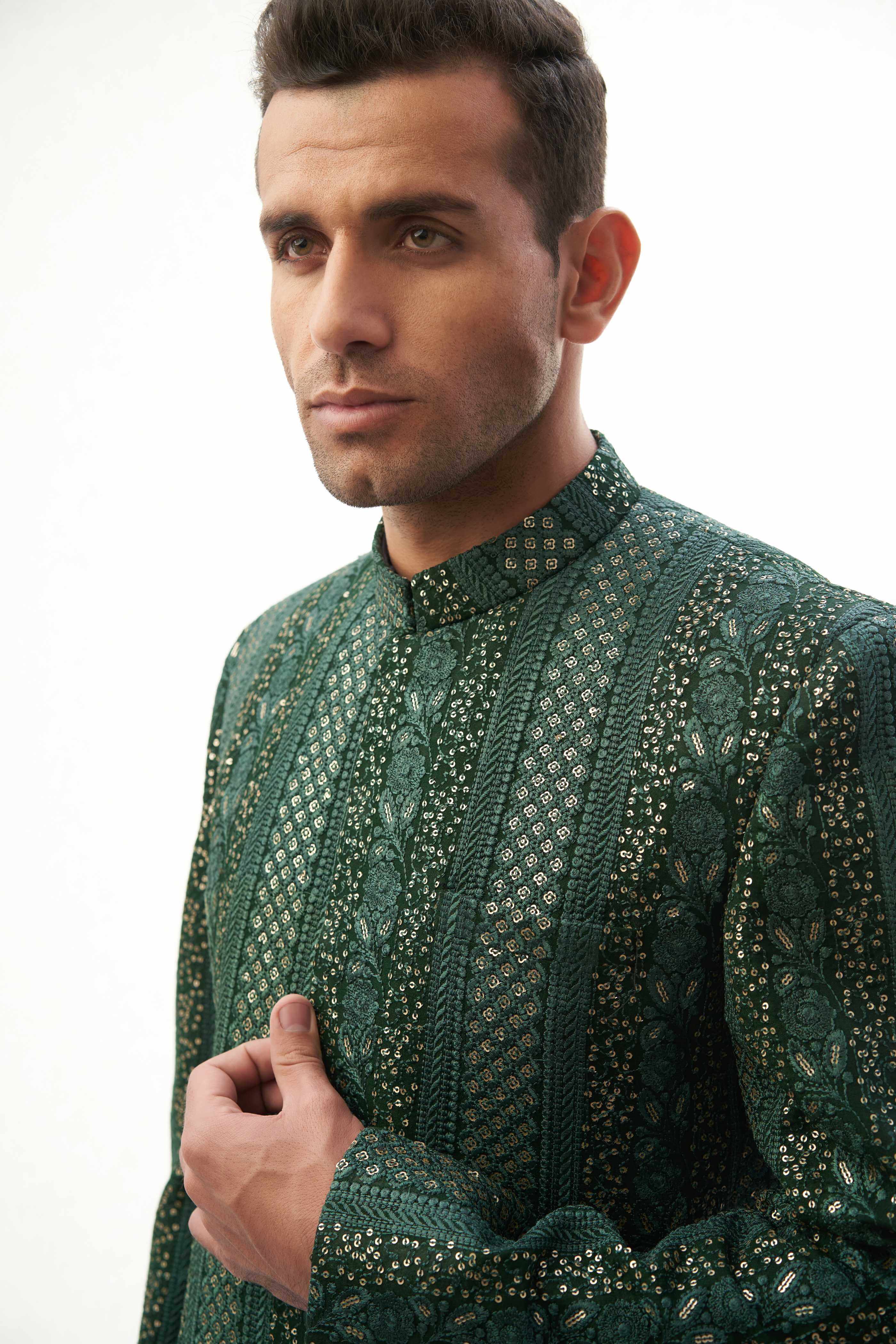 Emerald Green & Gold Short-Length Sherwani with Sequins – Elegant short-length sherwani featuring emerald green and gold colors with intricate sequin detailing.
