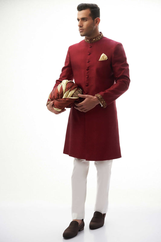 Maroon Brocade Silk Sherwani with Handcrafted Zardozi – Elegant maroon silk sherwani featuring intricate zardozi embroidery for a royal touch.