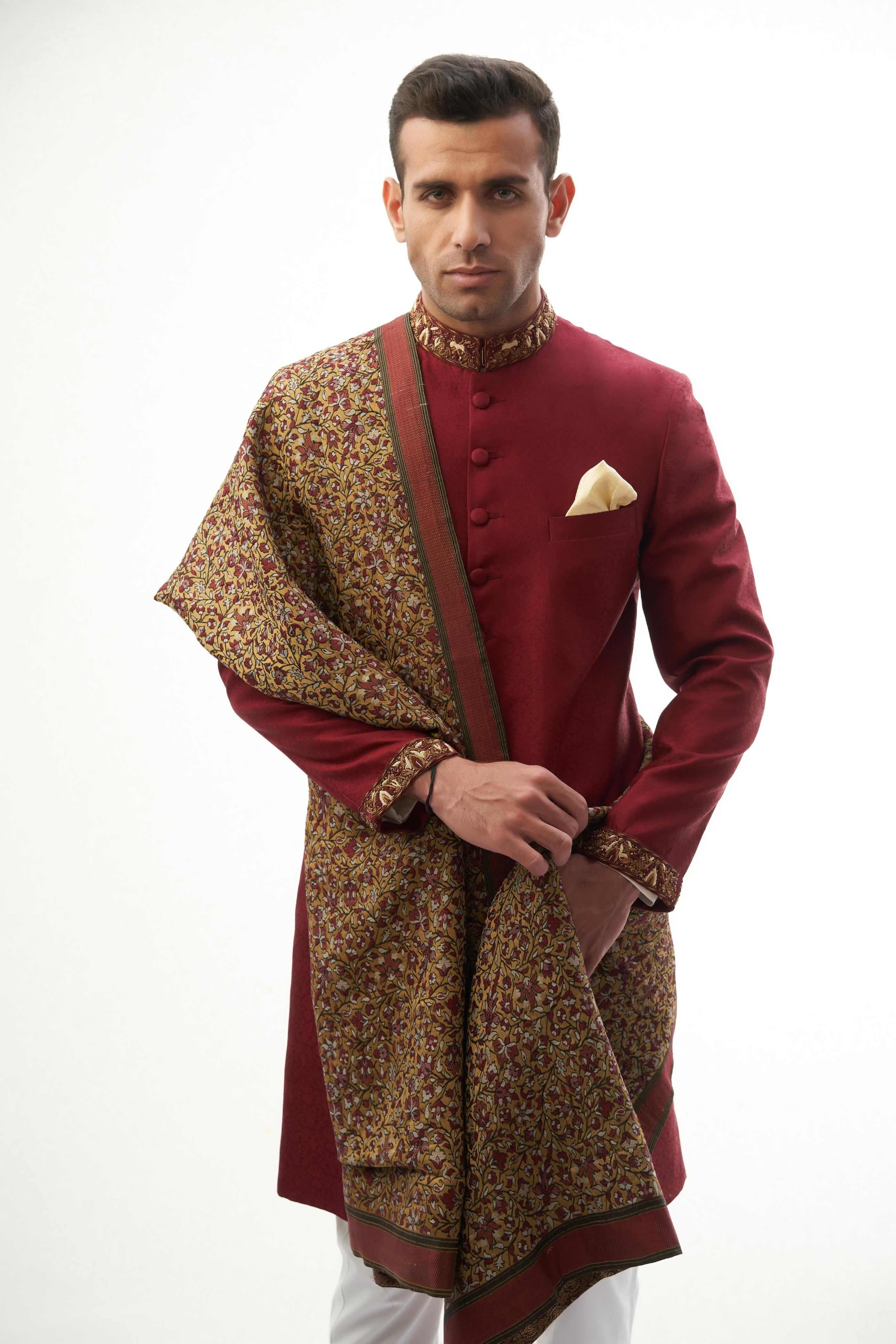 Maroon Brocade Silk Sherwani with Handcrafted Zardozi – Elegant maroon silk sherwani featuring intricate zardozi embroidery for a royal touch.