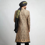 Antique gold and black brocade form-fitted sherwani with intricate embroidery, combining luxurious design and a modern tailored fit.