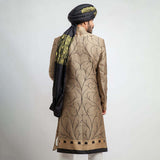 Antique gold and black brocade form-fitted sherwani with intricate embroidery, combining luxurious design and a modern tailored fit.