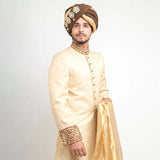 Arsalan Iqbal Cream Pure Jamavar Silk Form-Fitted Sherwani with Brown Turban and Gold Dupatta Upper Body Three-Quarter View for Men