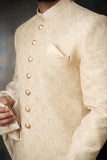 Arsalan Iqbal Gold Paisleys Rawsilk Sherwani Fabric and Custom AI Signature Buttons Detail View for Men