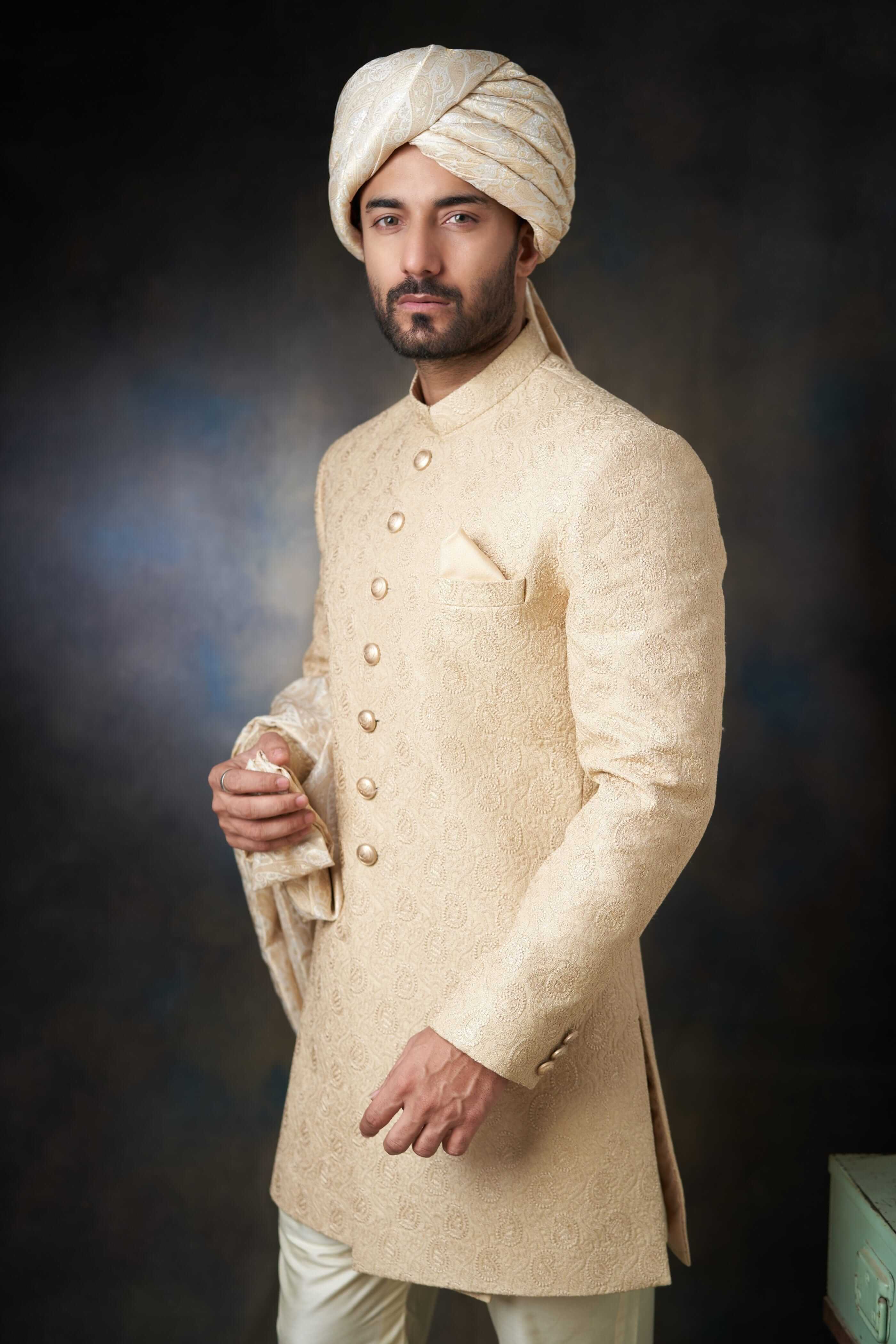 Arsalan Iqbal Gold Paisleys Rawsilk Sherwani with Custom AI Signature Buttons and Turban Upper Body Three-Quarter View for Men