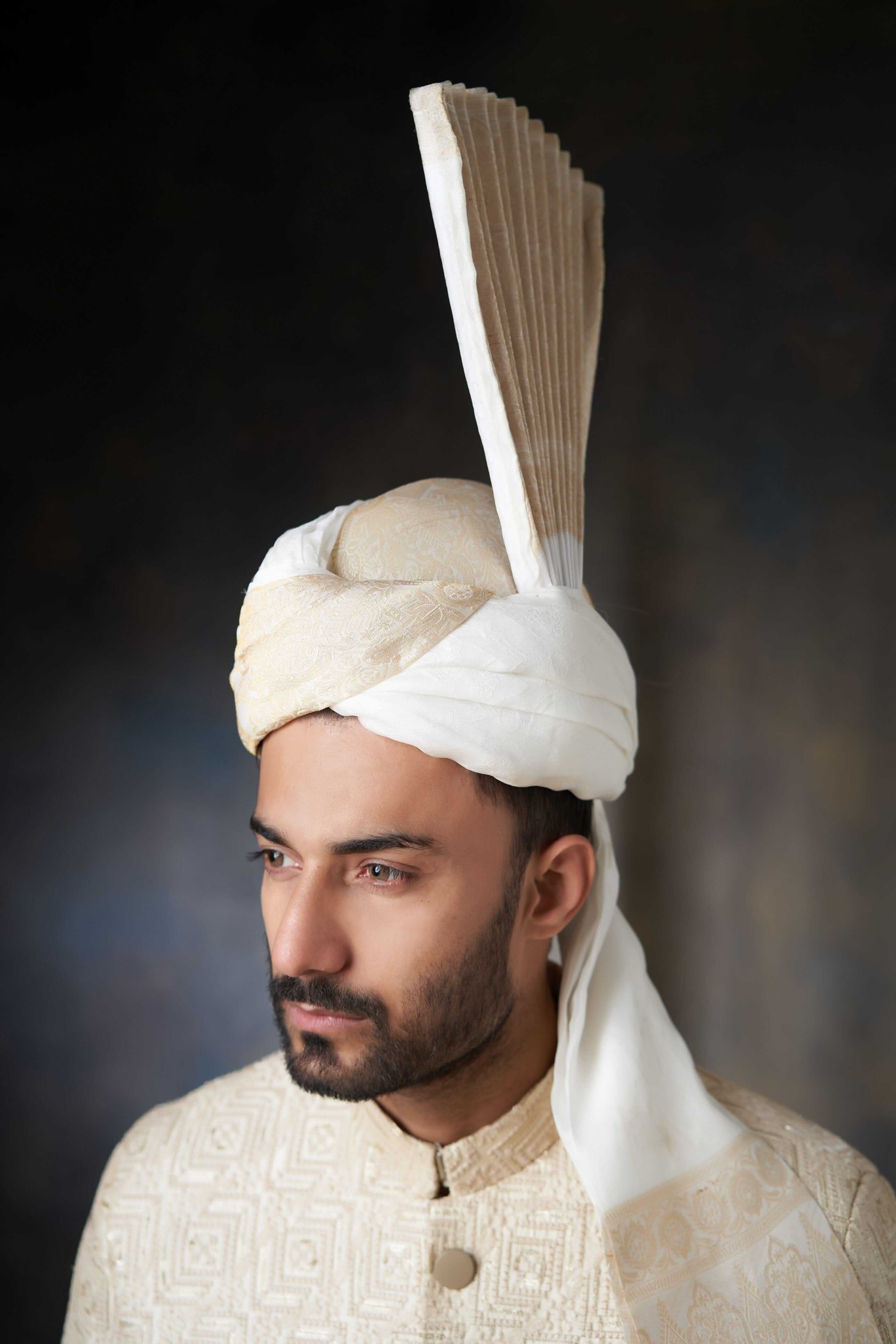 Arsalan Iqbal ivory and white silk turban with a tall pleated turra, featuring delicate self-embroidery and a matching sherwani collar.