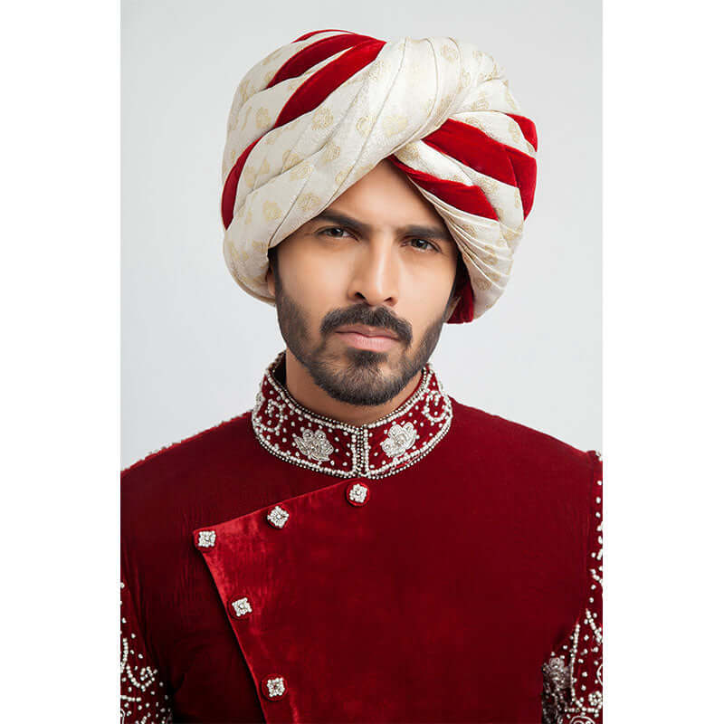 Burnt red velvet form-fitted sherwani featuring intricate detailing and a luxurious finish by Arsalan Iqbal, perfect for formal occasions.