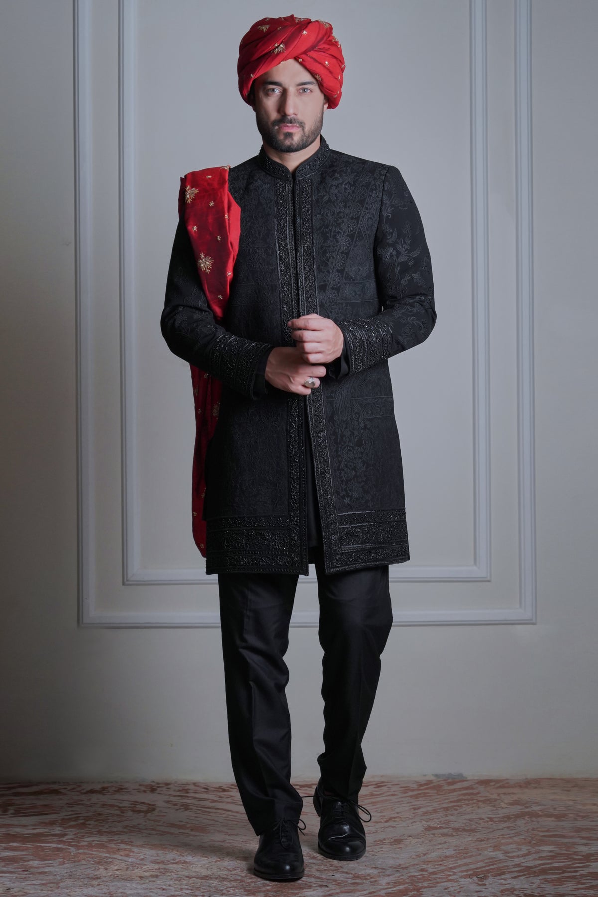 Ramih - A all black short sherwani jacket