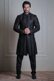 Male model wearing a black textured sherwani by Arsalan Iqbal, premium formal ethnic menswear with modern tailoring.