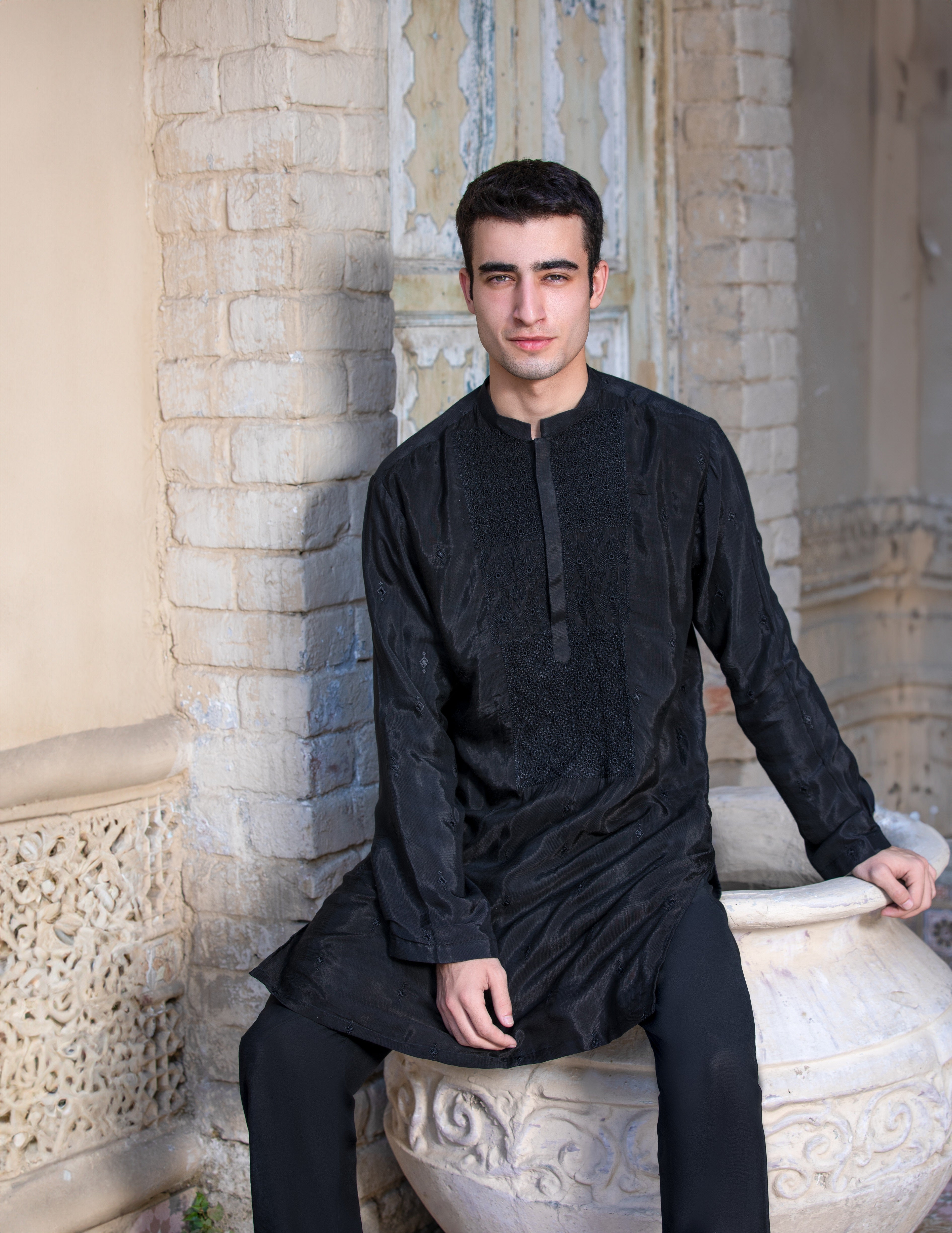 Arsalan Iqbal Jet Black Embroidered Raw Silk Kurta with Boot Cut Pants Seated View for Men