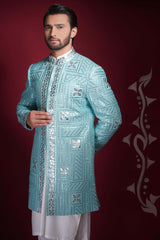 Arsalan Iqbal ice-blue prince coat with dense silver mirror-work in geometric patterns, featuring an embellished mandarin collar.