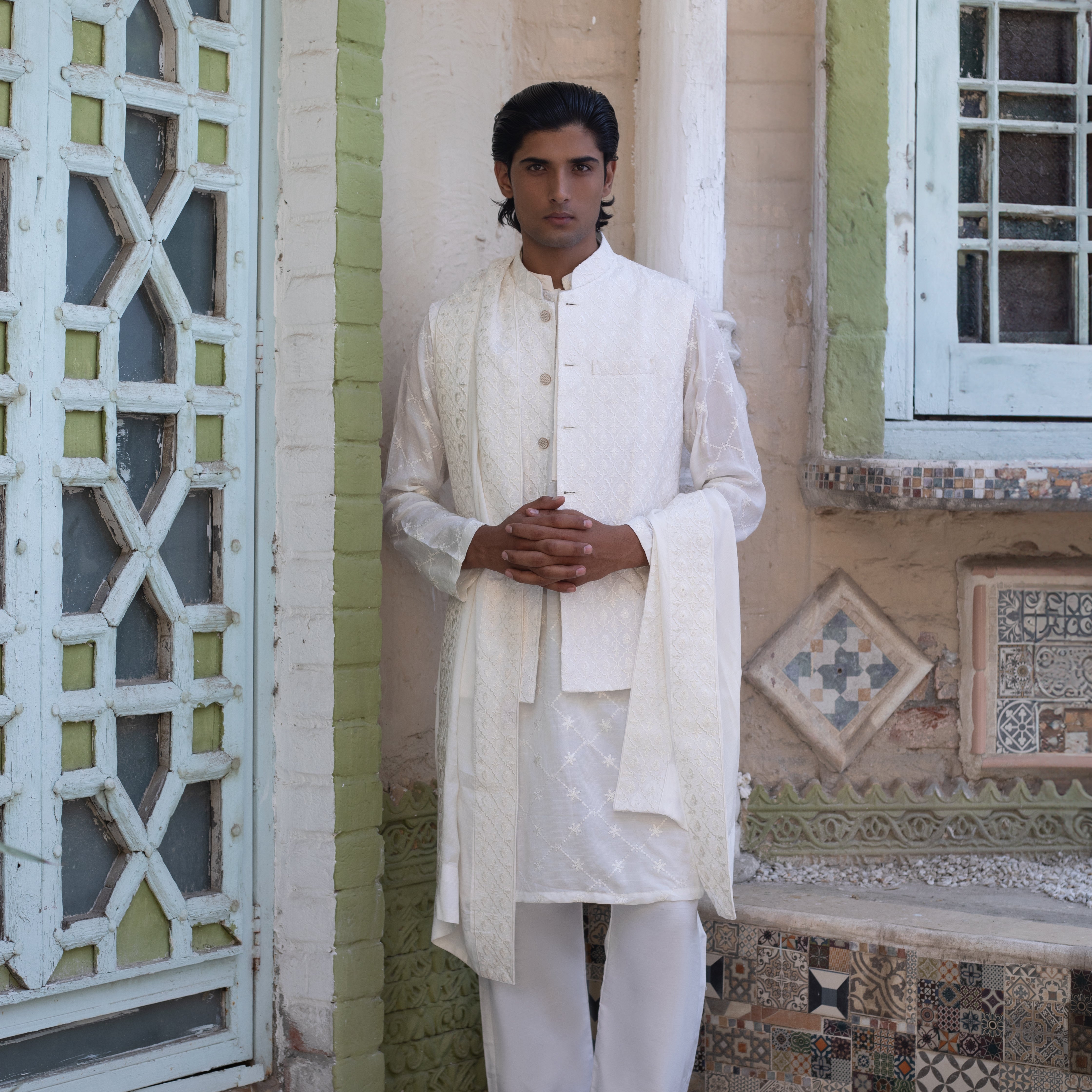Arsalan Iqbal Nukta-e-Nazar Front Standing Pose White Embroidered Waistcoat Kurta Set with Shawl for Men