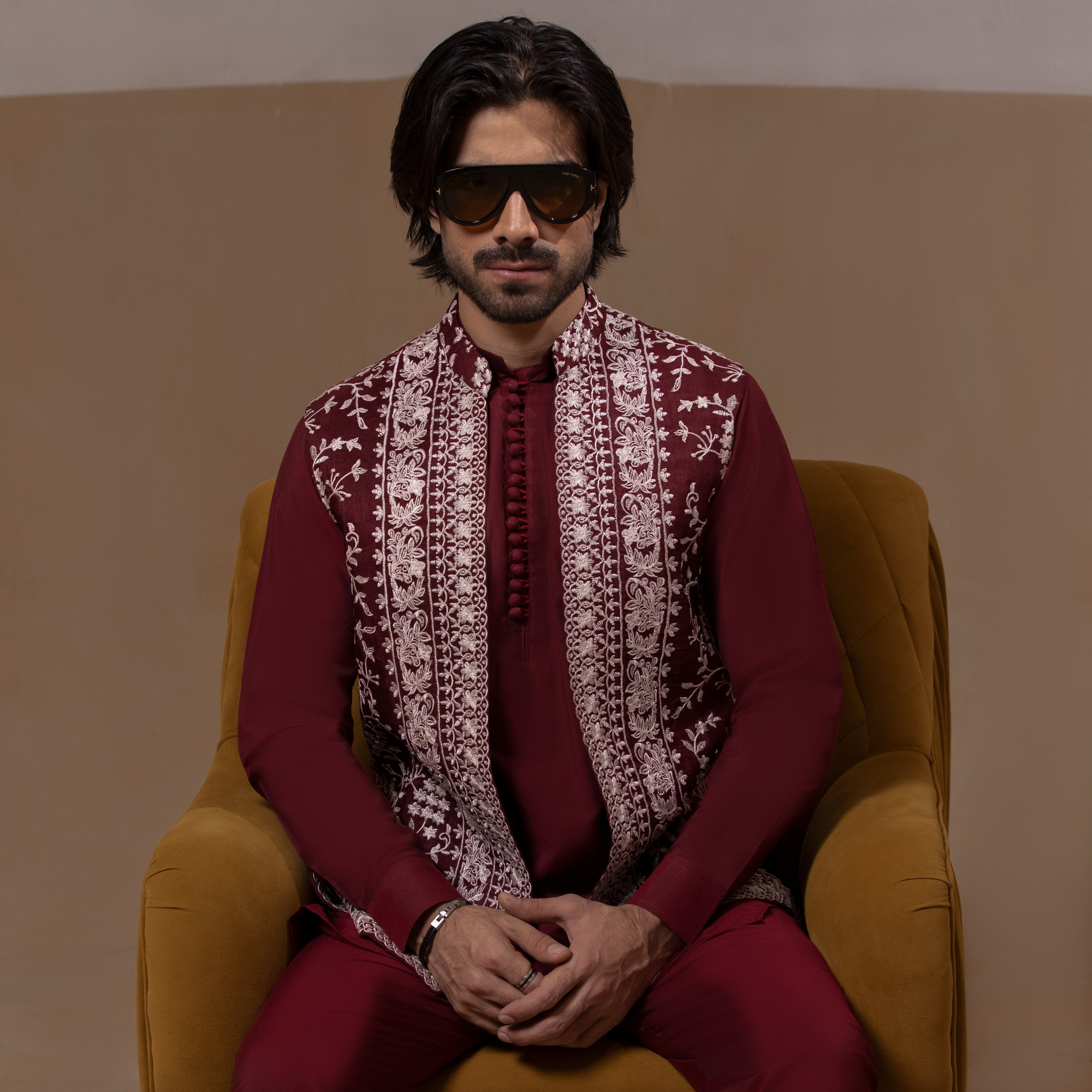 Arsalan Iqbal Sooch'2026 Fidaa Dark Maroon Front Open Waistcoat with IronEZ Kurta & Pyjama Set Seated View for Men