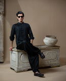 Arsalan Iqbal Sooch'2026 Jet Black IronEZ Textured Kurta and Pyjama Set Full Length Sitting View for Men