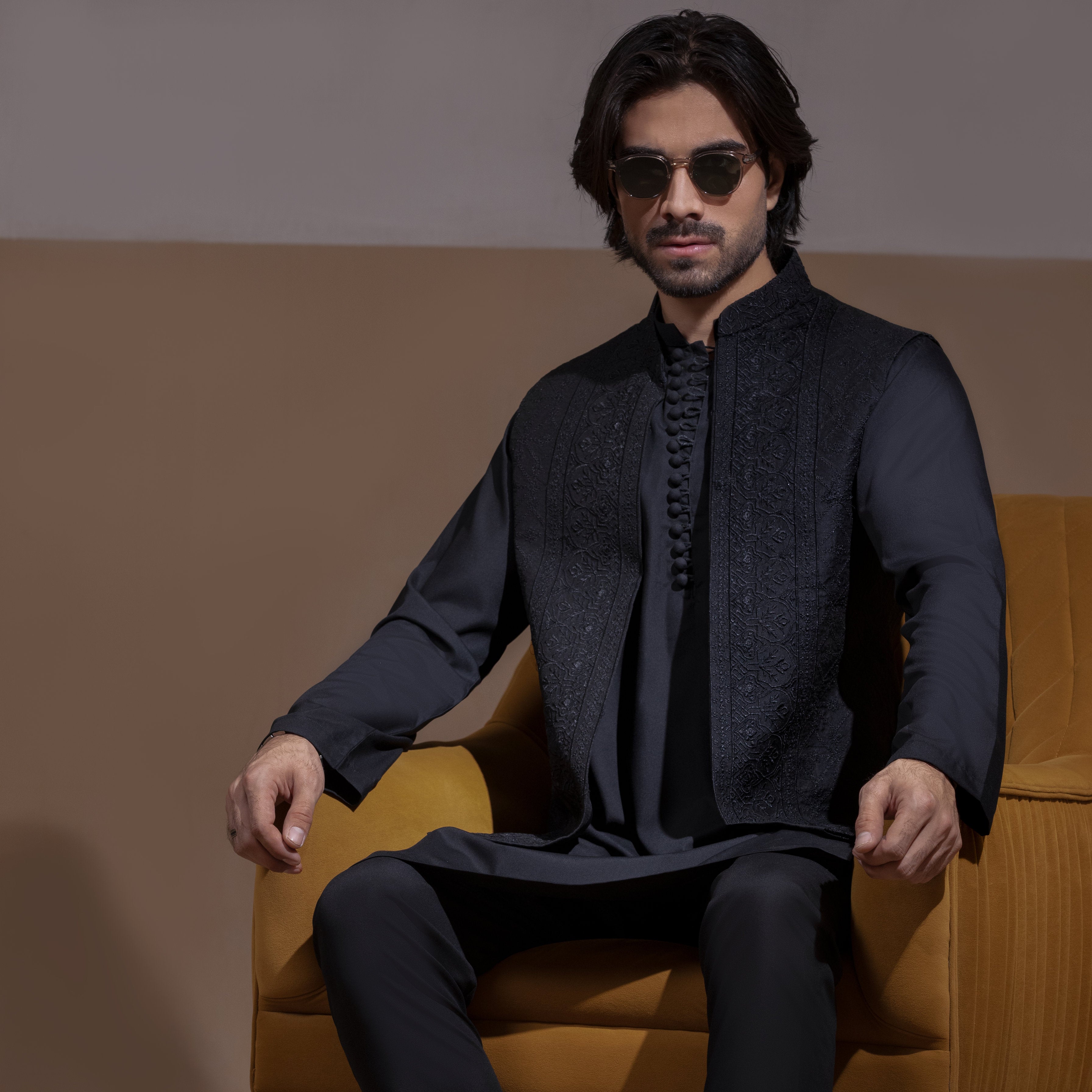 Arsalan Iqbal Sooch'2026 Jet Black Matte Front Open Waistcoat with IronEZ Kurta & Pyjama Set Seated View for Men