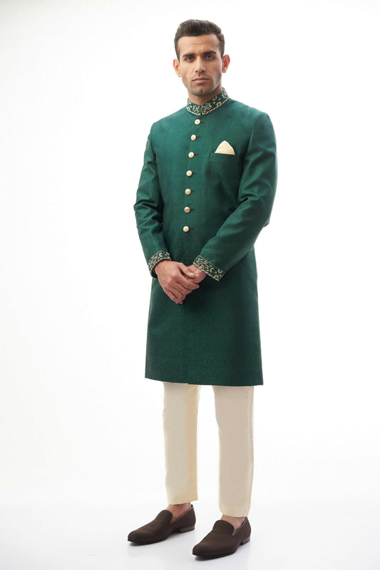 Emerald Green Brocade Silk Sherwani with Handcrafted Zardozi – Elegant and luxurious with intricate zardozi embroidery.