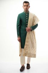 Emerald Green Brocade Silk Sherwani with Handcrafted Zardozi – Elegant and luxurious with intricate zardozi embroidery.
