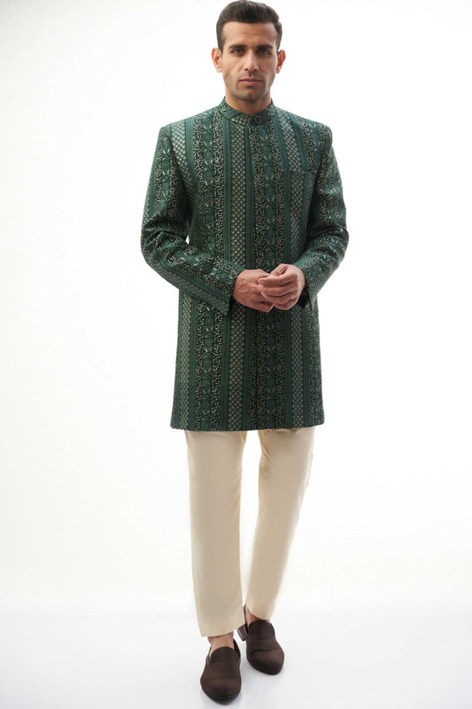  Emerald Green & Gold Short-Length Sherwani with Sequins – Elegant short-length sherwani featuring emerald green and gold colors with intricate sequin detailing.