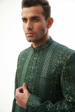  Emerald Green & Gold Short-Length Sherwani with Sequins – Elegant short-length sherwani featuring emerald green and gold colors with intricate sequin detailing.