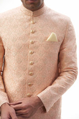 Peach Rawsilk Sherwani with All-Over Intricate Embroidery, Perfect for Traditional and Wedding Occasions.
