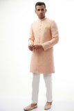 Peach Rawsilk Sherwani with All-Over Intricate Embroidery, Perfect for Traditional and Wedding Occasions.