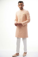 Peach Rawsilk Sherwani with All-Over Intricate Embroidery, Perfect for Traditional and Wedding Occasions.