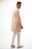 Peach Rawsilk Sherwani with All-Over Intricate Embroidery, Perfect for Traditional and Wedding Occasions.