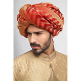 Antique gold, grey, and red brocade sherwani with a form-fitted cut, featuring intricate patterns and rich detailing for a regal appearance.