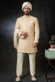 Arsalan Iqbal Gold Paisleys Rawsilk Sherwani with Custom AI Signature Buttons and Turban Full Length Front View for Men
