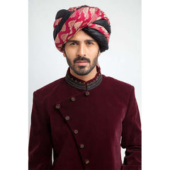 Close-up of Arsalan Iqbal maroon velvet sherwani with embroidered collar and pink paisley patterned turban.