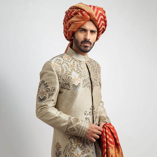 Ecru and grey brocade sherwani with a tailored fit, featuring intricate woven detailing for a regal, formal look.