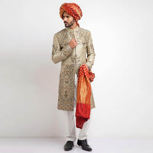 Ecru and grey brocade sherwani with a tailored fit, featuring intricate woven detailing for a regal, formal look.