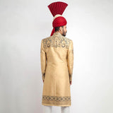 Exquisite Peach Gold and Grey Brocade Sherwani with detailed embroidery, perfect for a regal and sophisticated look at special occasions.